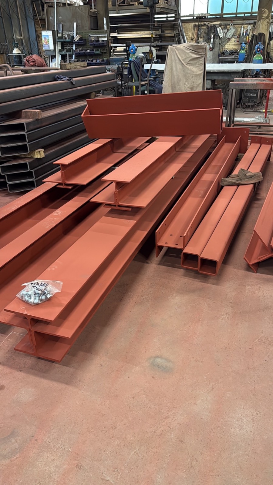 Fabricated structural steel beams primed and ready