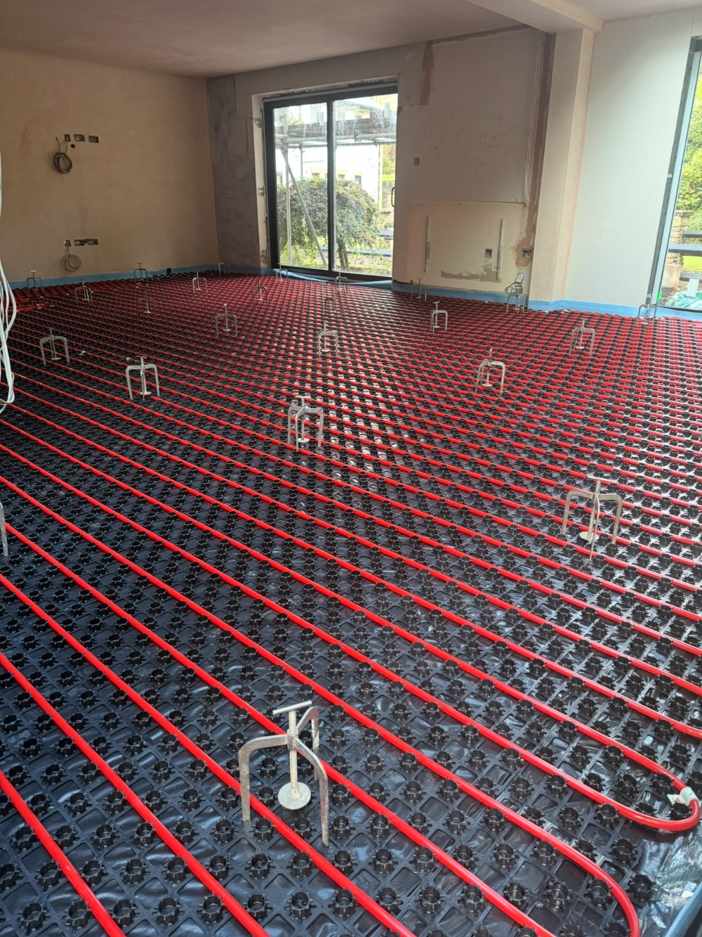 Underfloor heating pipe layout clipped to insulation