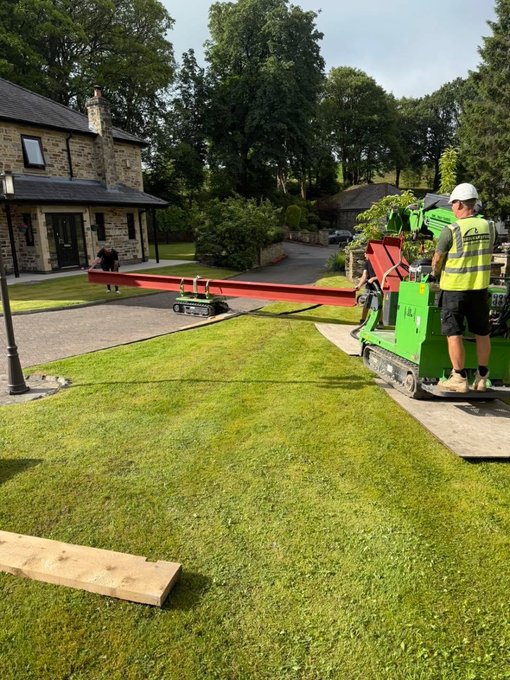 Steel beam being moved with specialist machinery