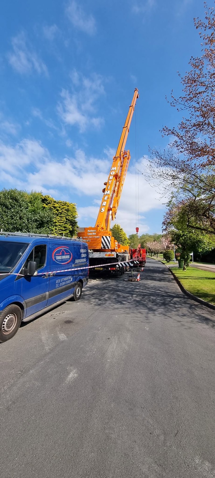 Tonge Builders van on site with a mobile crane